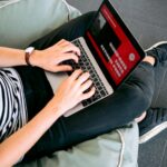 Man Creating a Presentation on Laptop